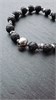Браслет из лавы и гематита с черепами 2368